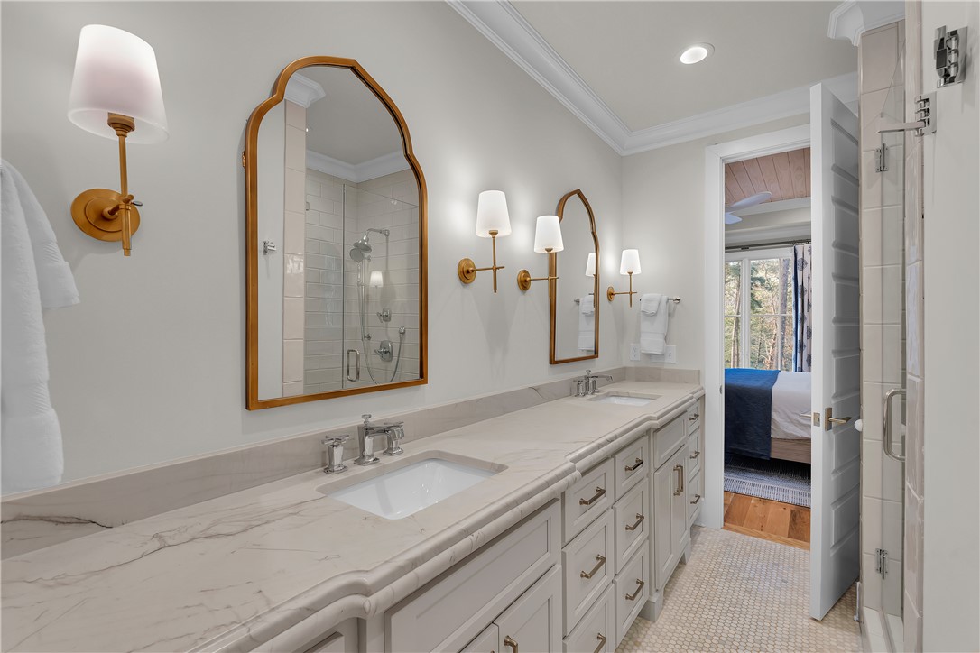 243 Quay Court Sunset, SC 29685 - Photo 17 of 46 This bathroom features elegant fixtures and ample counter space, connecting seamlessly to a cozy bedroom.