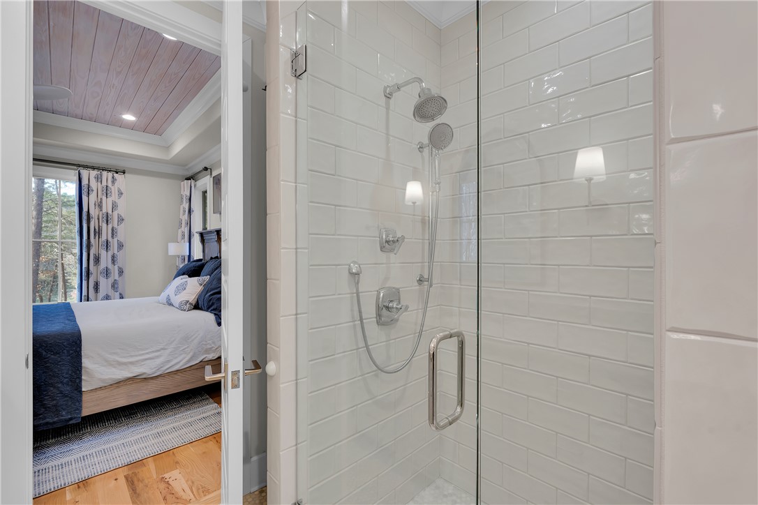 243 Quay Court Sunset, SC 29685 - Photo 18 of 46 This primary bedroom and bath combination offers comfortable living and relaxation.