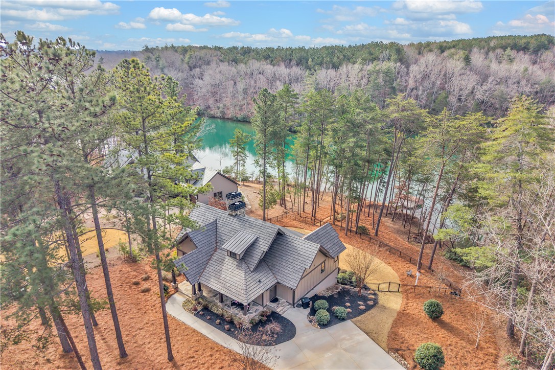 243 Quay Court Sunset, SC 29685 - Photo 2 of 46 This serene lakeside property offers tranquil waterfront living amidst a natural landscape.