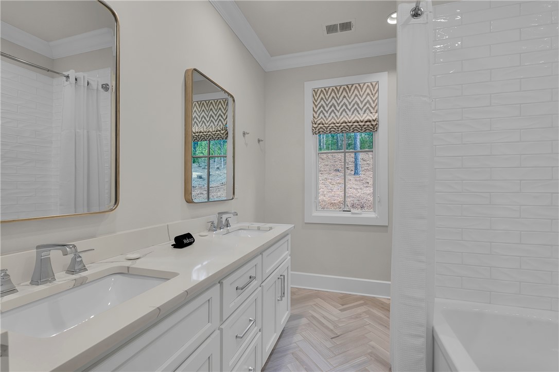 243 Quay Court Sunset, SC 29685 - Photo 21 of 46 This bright bathroom offers a tranquil retreat with ample counter space and natural light.