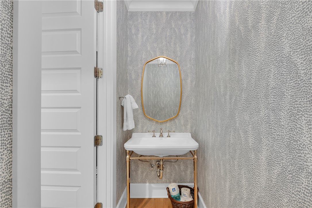 243 Quay Court Sunset, SC 29685 - Photo 22 of 46 This inviting powder room offers a sleek basin and ample lighting for daily routines.