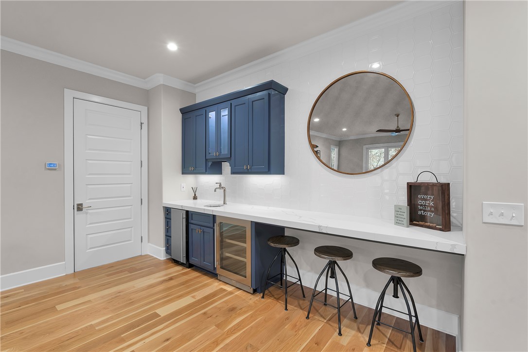 243 Quay Court Sunset, SC 29685 - Photo 25 of 46 This contemporary wet bar features sleek design and functional amenities, perfect for entertaining.