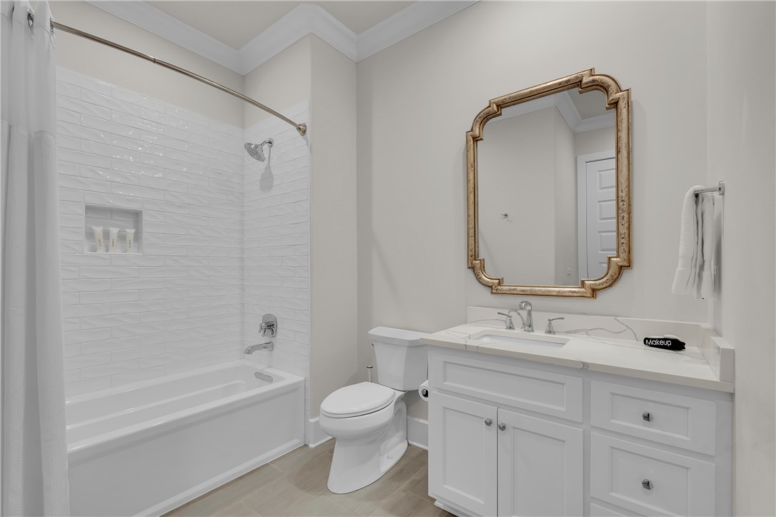 243 Quay Court Sunset, SC 29685 - Photo 29 of 46 This bright bathroom features a vanity, bathtub, and elegant gold-framed mirror.