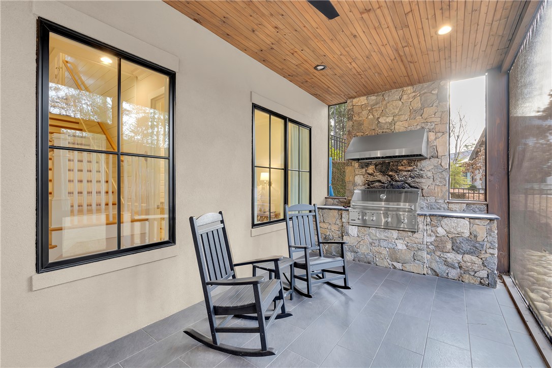 243 Quay Court Sunset, SC 29685 - Photo 32 of 46 This inviting patio features a built-in outdoor kitchen, perfect for entertaining.