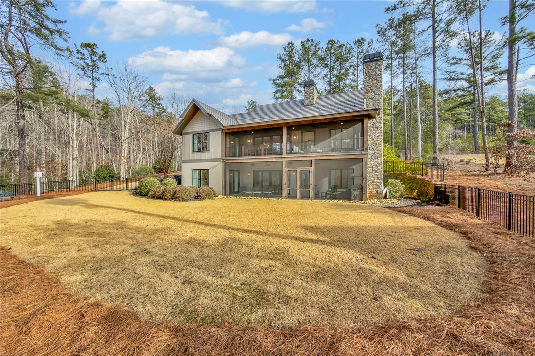 243 Quay Court Sunset, SC 29685 - Photo 33 of 46 This spacious house offers two levels of covered outdoor living, perfect for enjoying the natural surroundings.