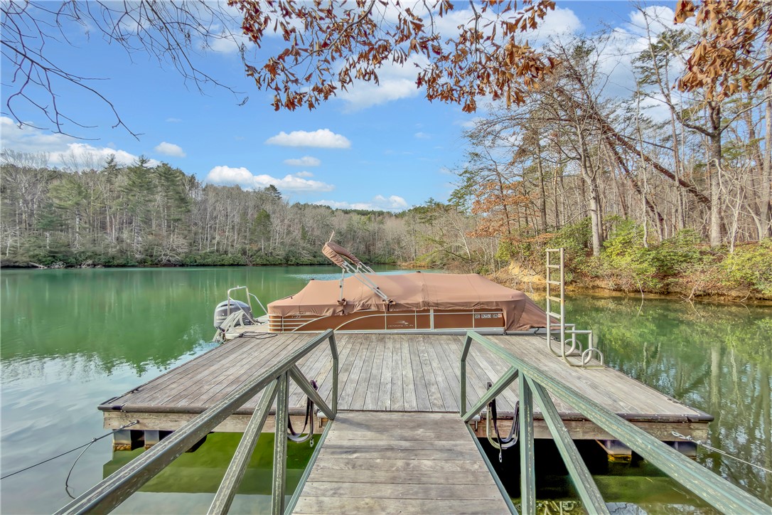 243 Quay Court Sunset, SC 29685 - Photo 36 of 46 This serene lakefront property boasts a private boat dock, perfect for waterfront recreation.