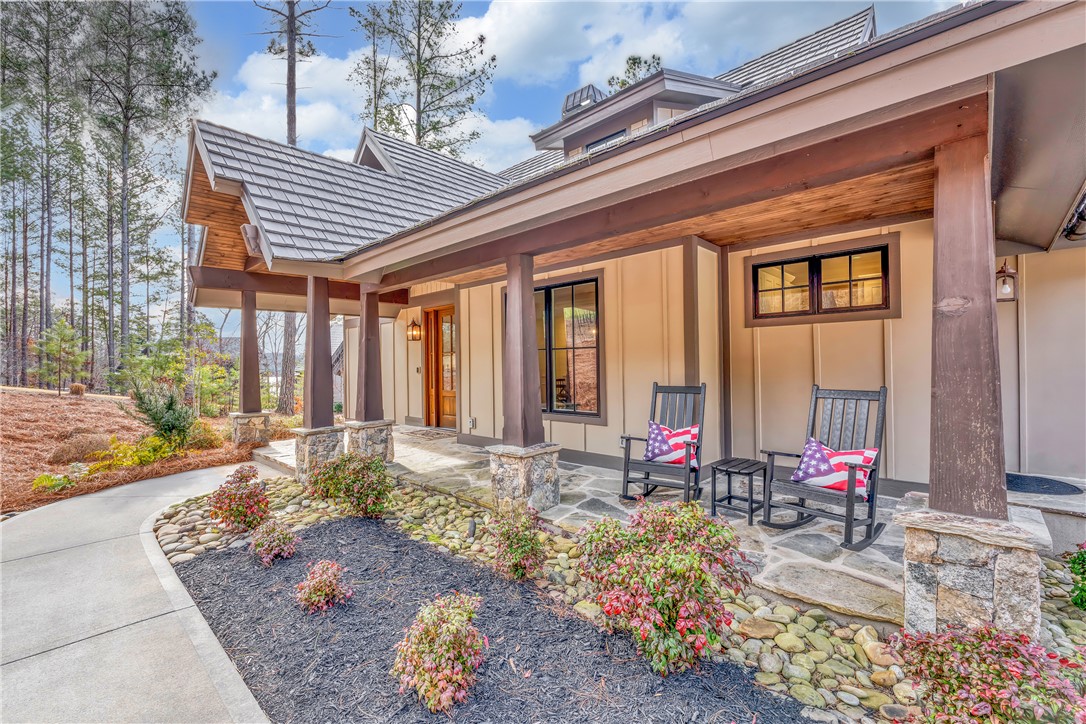 243 Quay Court Sunset, SC 29685 - Photo 4 of 46 This inviting home showcases a welcoming front porch, perfect for enjoying peaceful outdoor moments.