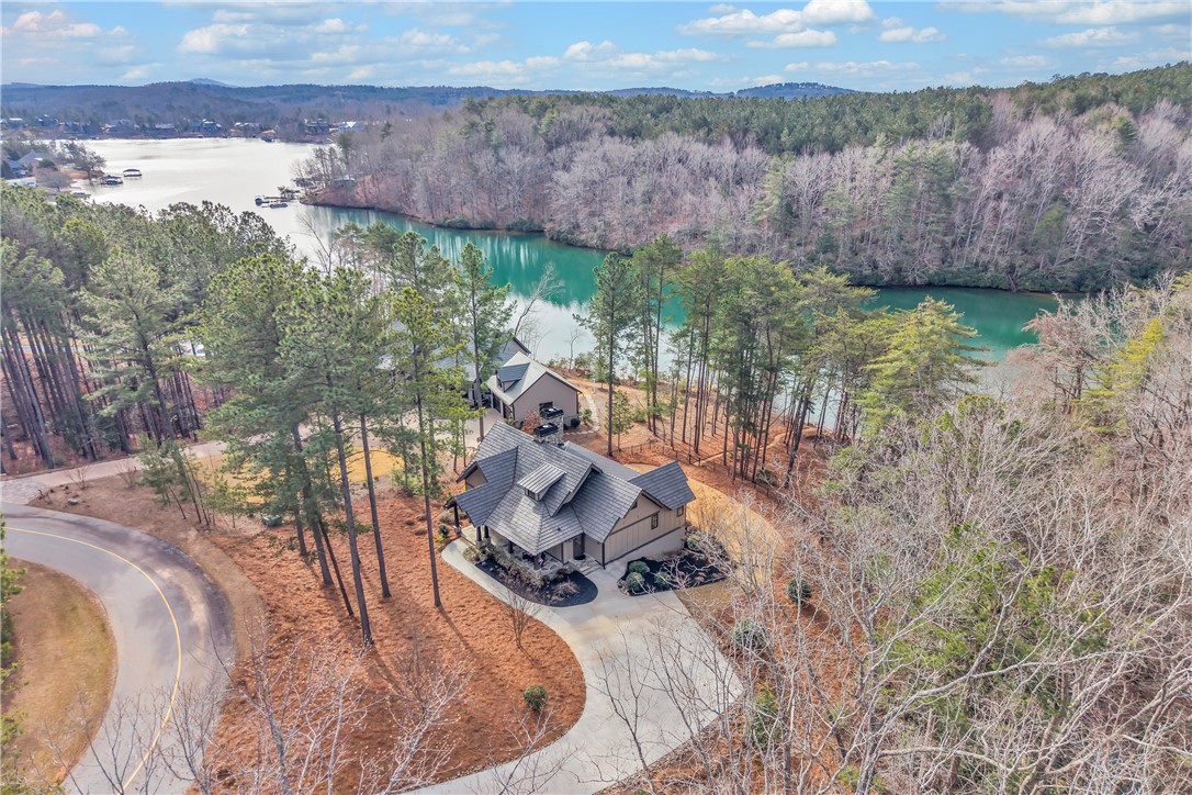 243 Quay Court Sunset, SC 29685 - Photo 42 of 46 This lakeside home offers expansive water views and a serene natural setting.