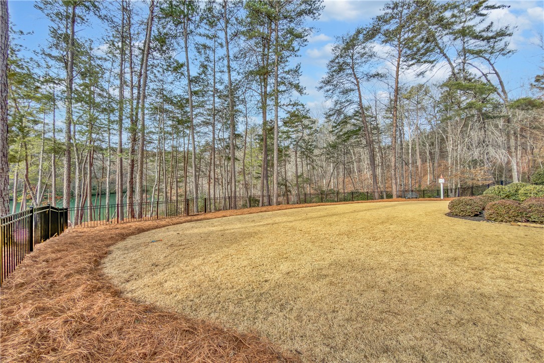 243 Quay Court Sunset, SC 29685 - Photo 43 of 46 This spacious yard offers serene water views, perfect for outdoor living and recreation.