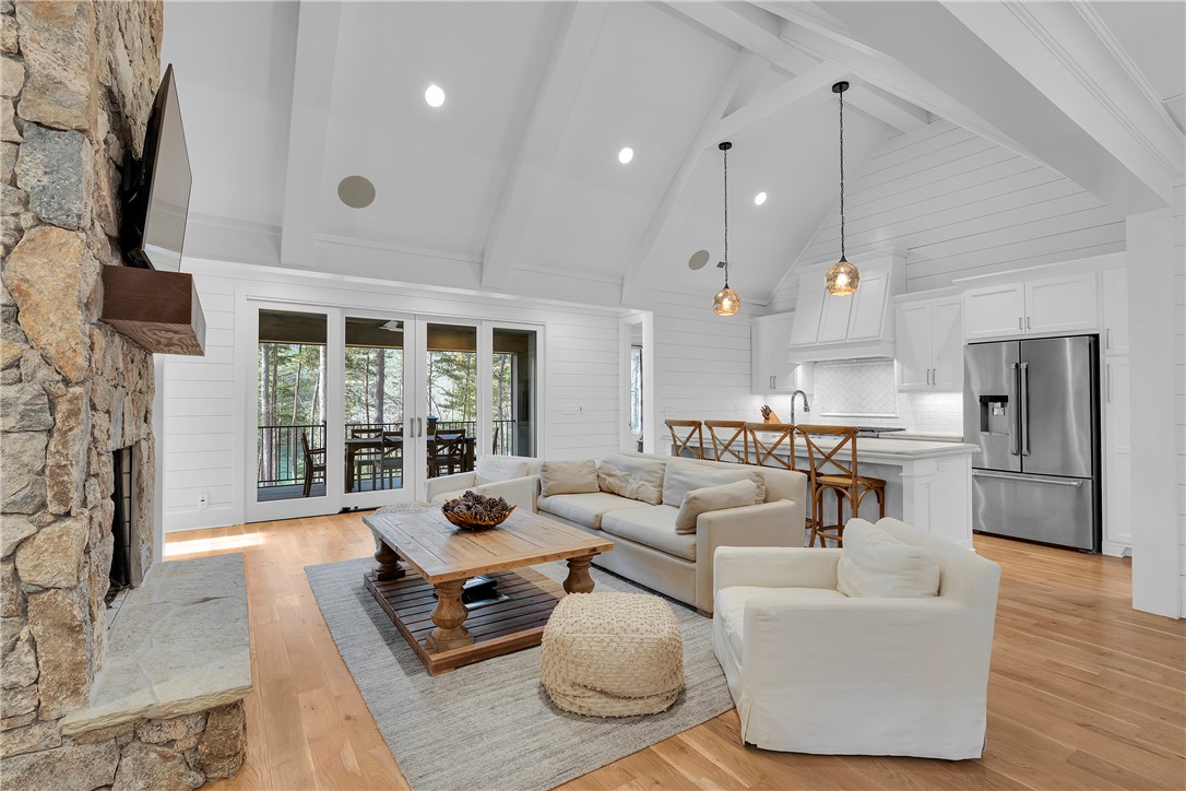 243 Quay Court Sunset, SC 29685 - Photo 7 of 46 This bright living area features an open concept layout with natural light and hardwood floors.