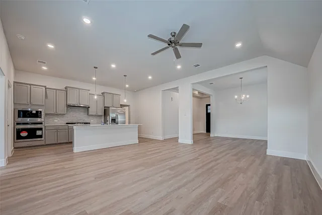a view of kitchen with furniture and wooden floor