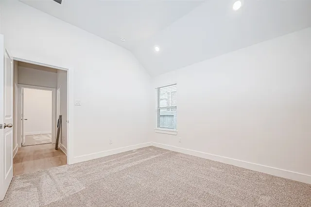 an empty room with a empty space and windows