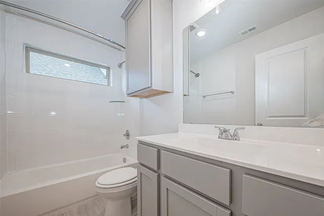 a bathroom with a sink a toilet and a bathtub