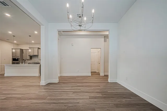 a view of hall with kitchen