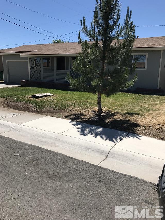 1175 Goldfield Street Reno, NV 89512 - Photo 2 of 7 a view of a house with a yard