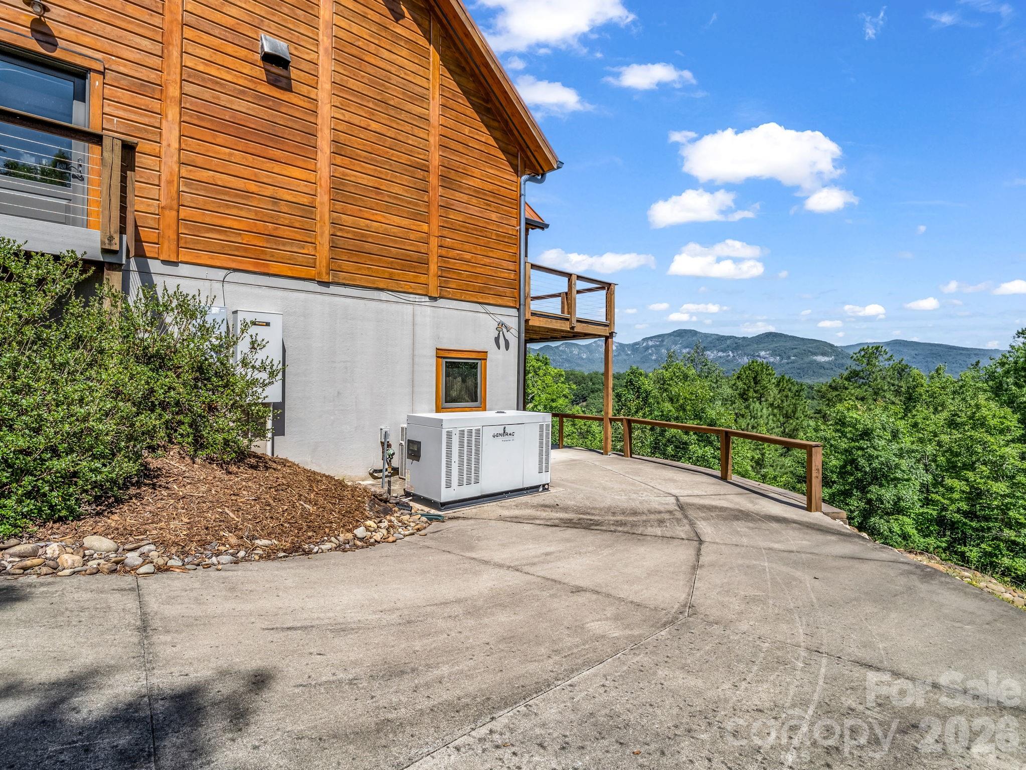 590 Boulder Ridge Lake Lure, NC 28746 - Photo 45 of 48 a view of a house with backyard and garden