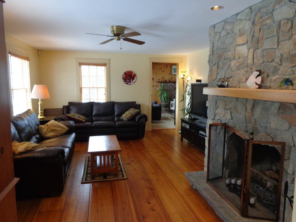 8 Goose Pond Road Acton, ME 04001 - Photo 3 of 28 Living room with fireplace and wide...