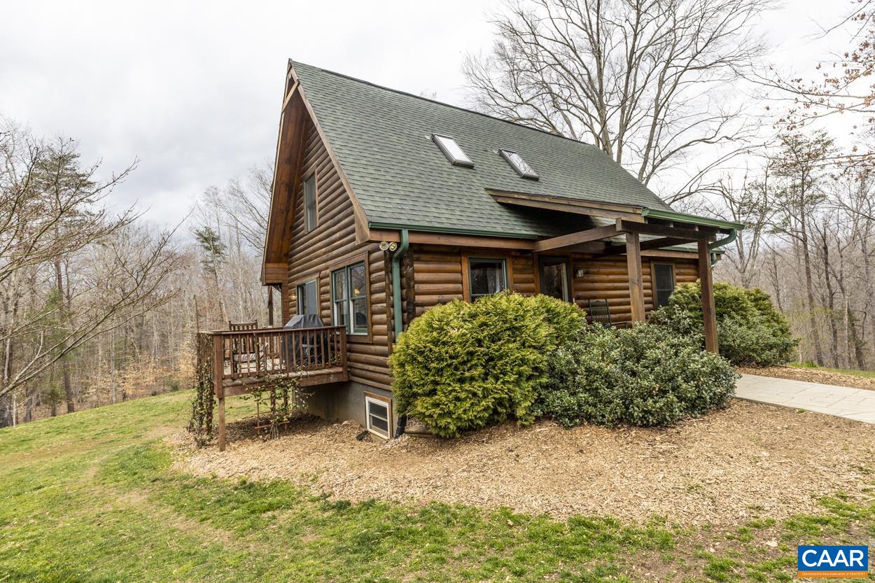 136 Buffalo Run Road Stanardsville, VA 22973 - Photo 1 of 64 a front view of a house with garden