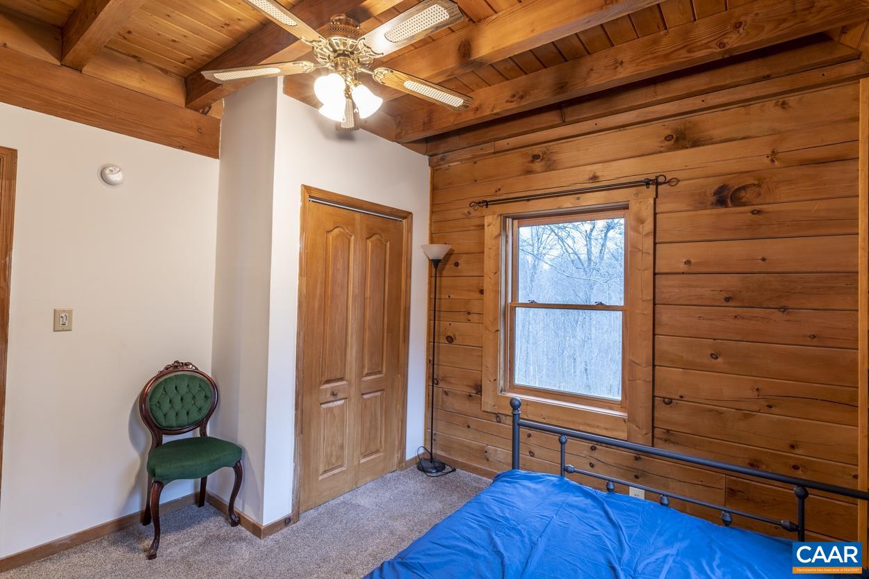 136 Buffalo Run Road Stanardsville, VA 22973 - Photo 23 of 64 a view of room with hardwood floor and cabinet