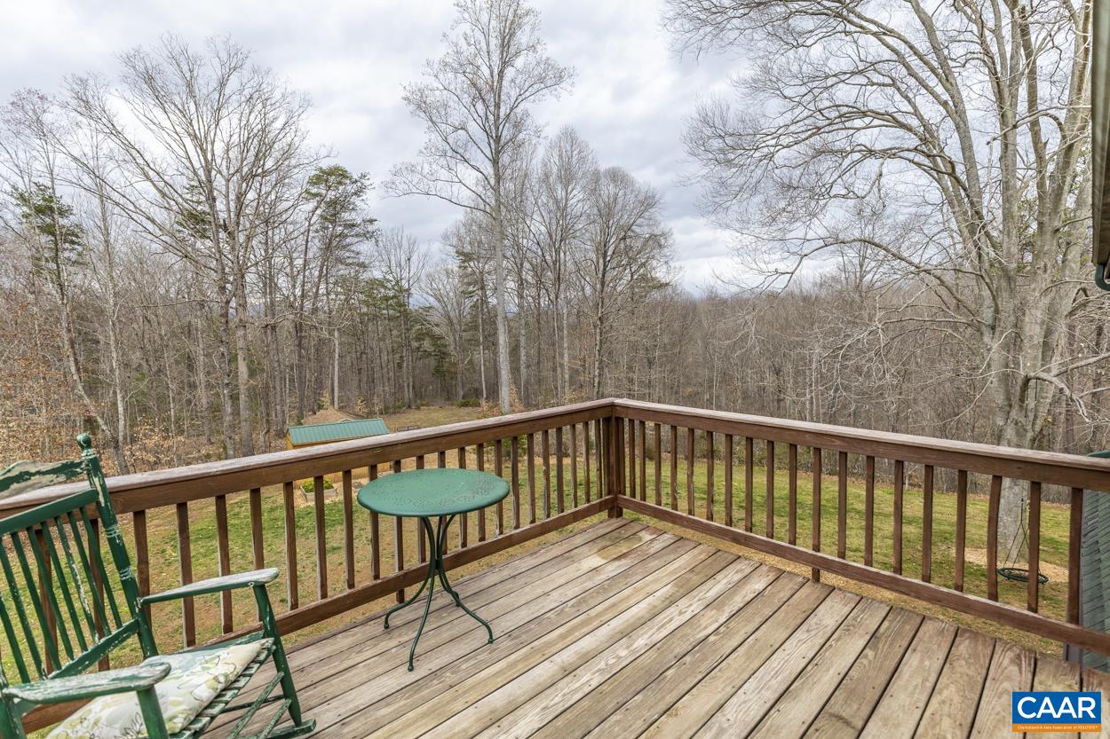 136 Buffalo Run Road Stanardsville, VA 22973 - Photo 35 of 64 a view of balcony with wooden floor and fence