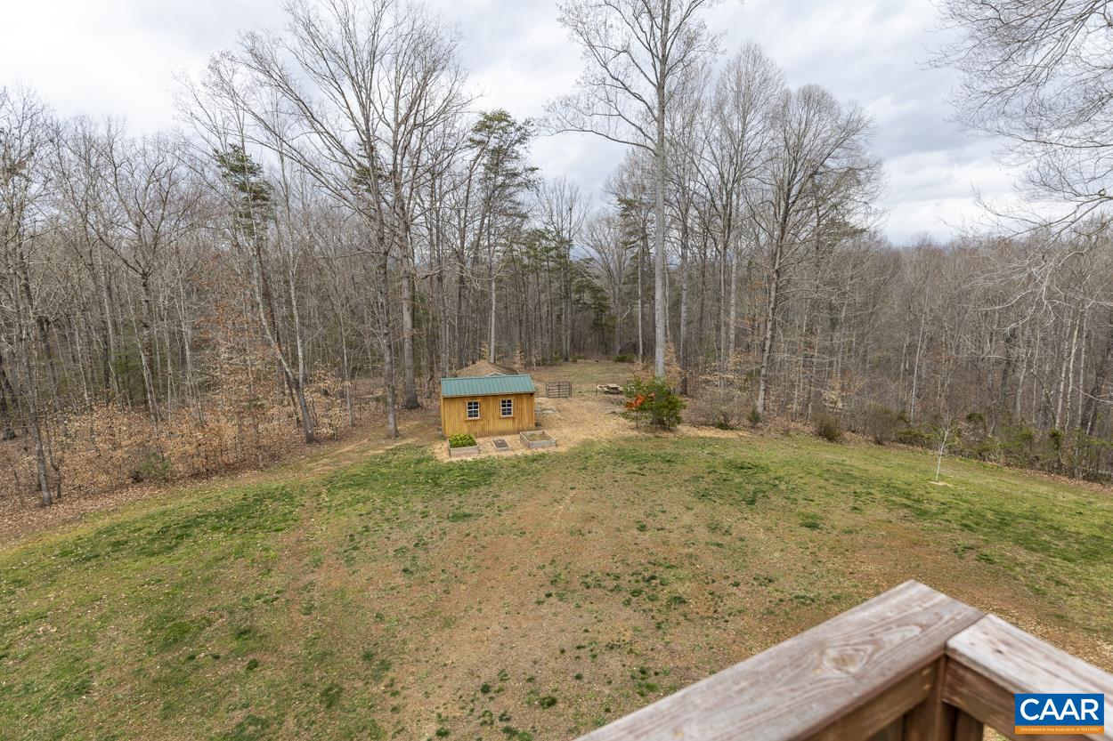136 Buffalo Run Road Stanardsville, VA 22973 - Photo 36 of 64 a backyard of a house with lots of green space