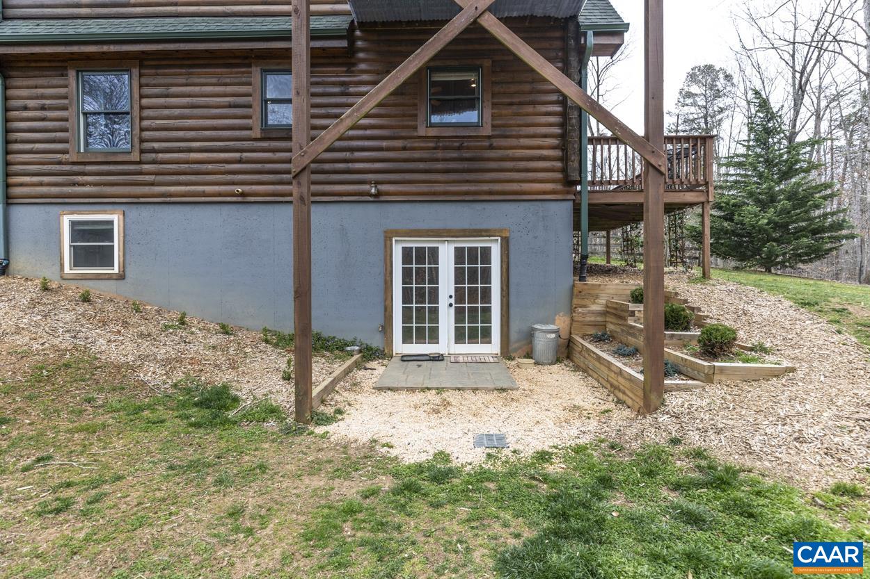 136 Buffalo Run Road Stanardsville, VA 22973 - Photo 56 of 64 a front view of a house with garden
