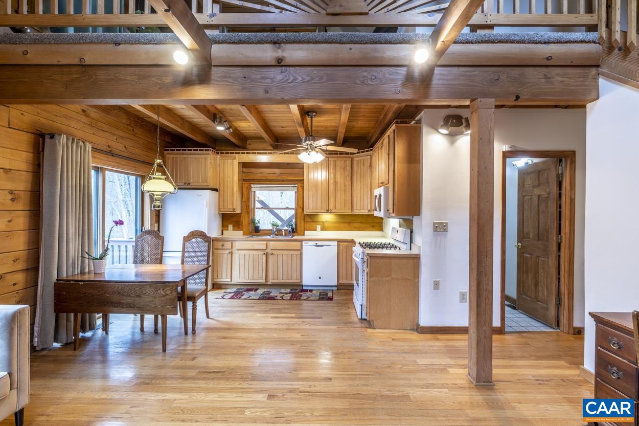 136 Buffalo Run Road Stanardsville, VA 22973 - Photo 6 of 64 a view of a kitchen with stainless steel appliances wooden floor and chair