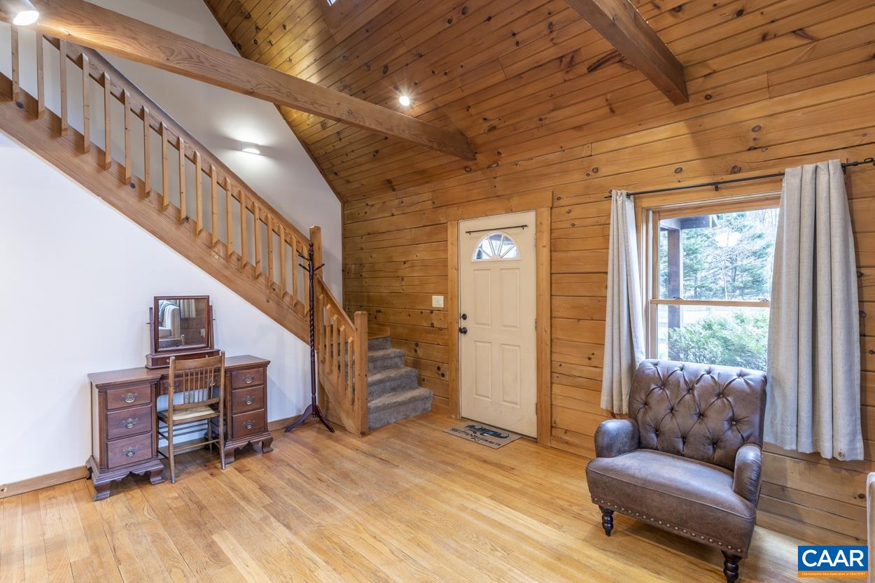 136 Buffalo Run Road Stanardsville, VA 22973 - Photo 8 of 64 a living room with furniture and a wooden floor