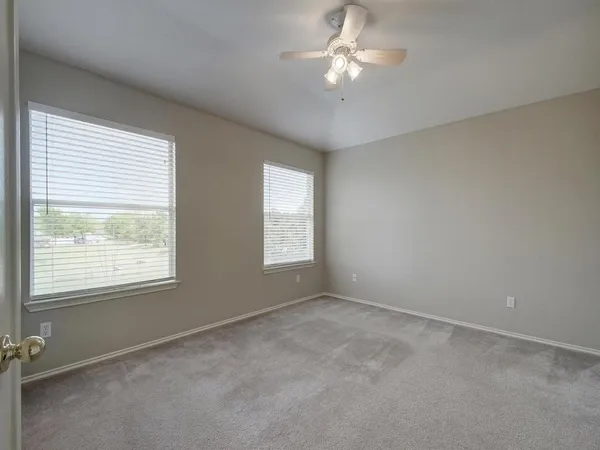 a view of empty room with windows