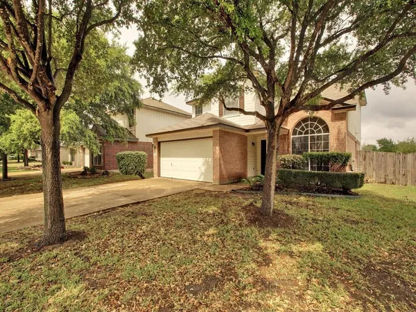 a house with trees in front of it