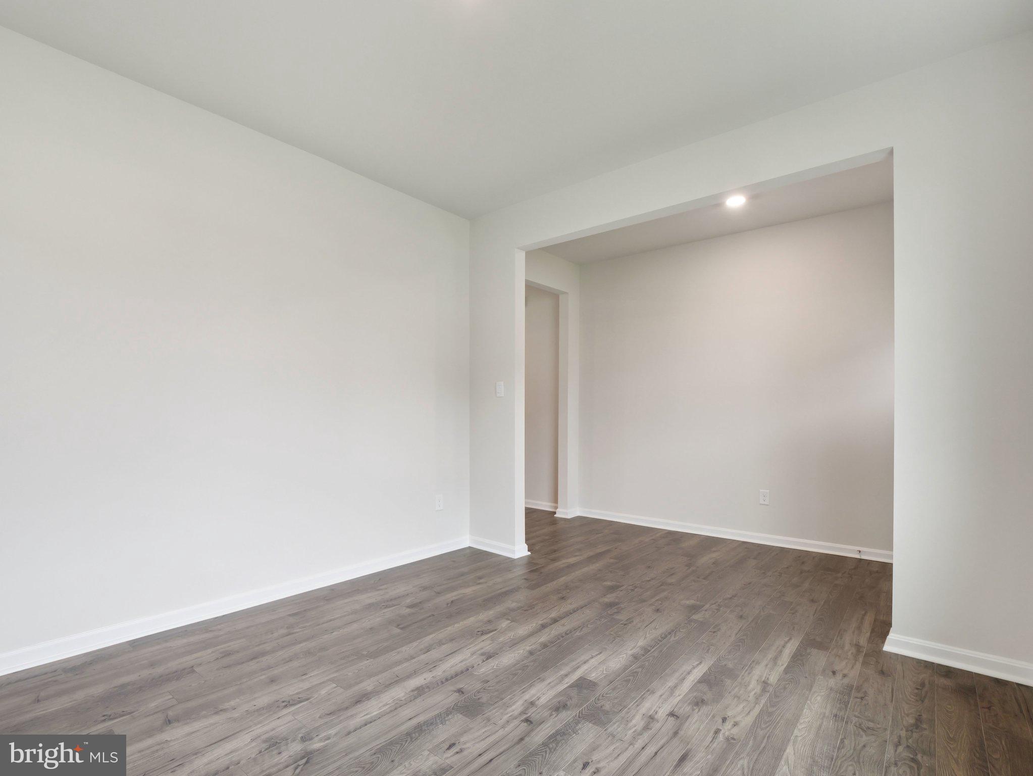6302 Sterling Way Ruther Glen, VA 22546 - Photo 12 of 31 a view of an empty room with wooden floor