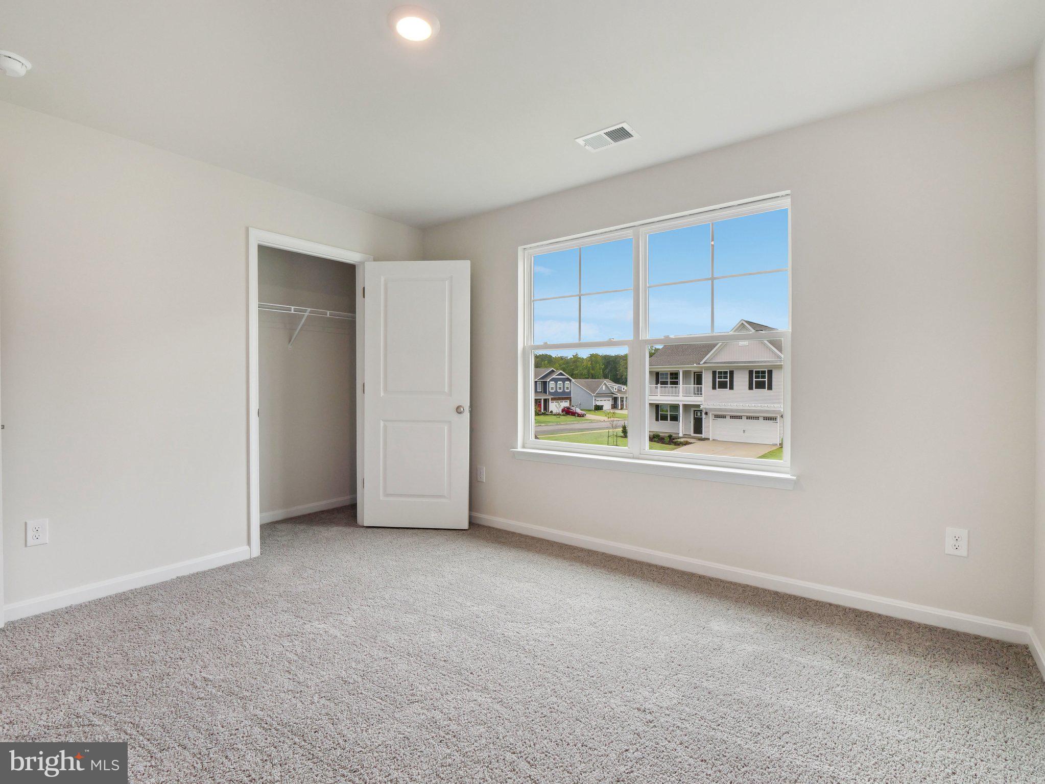 6302 Sterling Way Ruther Glen, VA 22546 - Photo 14 of 31 a view of a big room with windows and chandelier fan