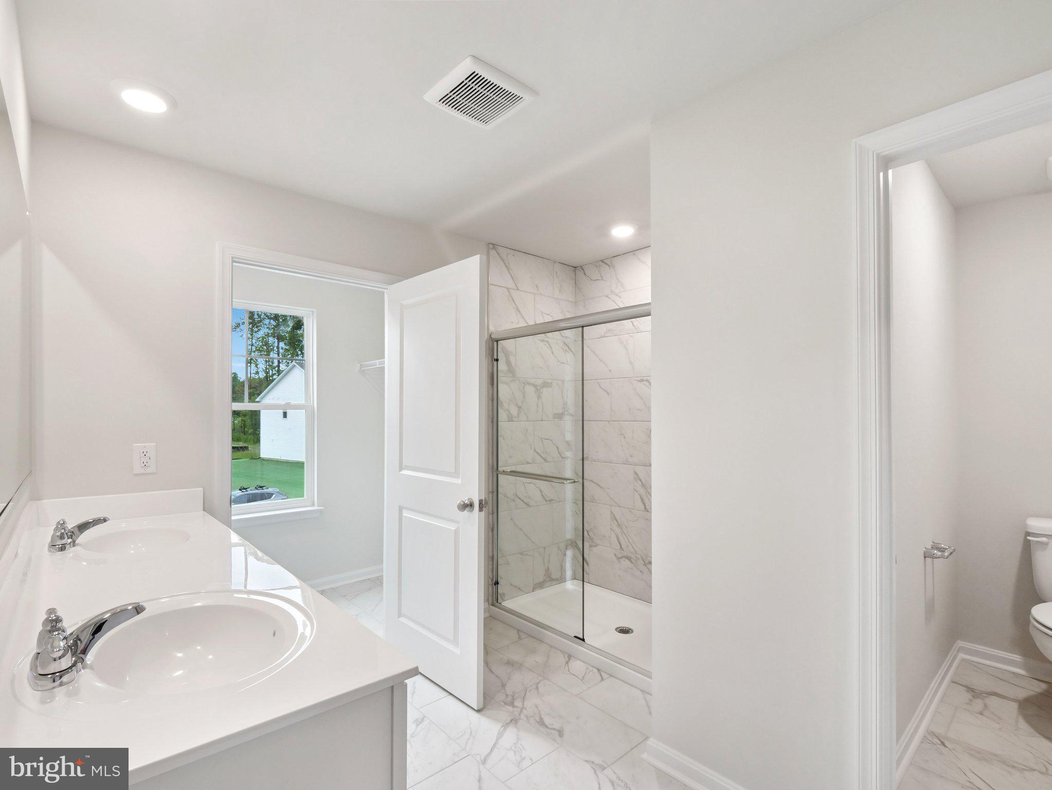 6302 Sterling Way Ruther Glen, VA 22546 - Photo 22 of 31 a bathroom with a sink toilet and shower