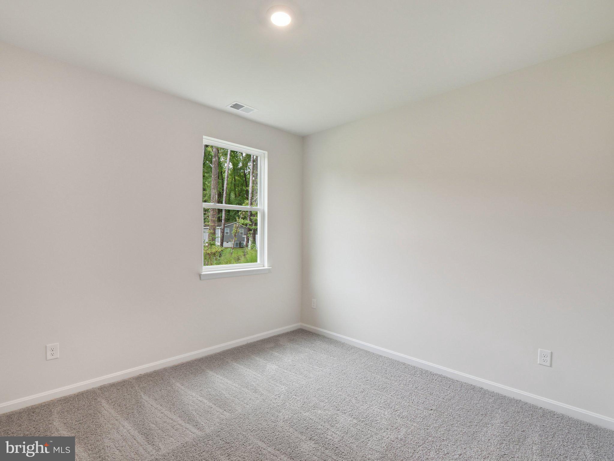 6302 Sterling Way Ruther Glen, VA 22546 - Photo 30 of 31 an empty room with a window