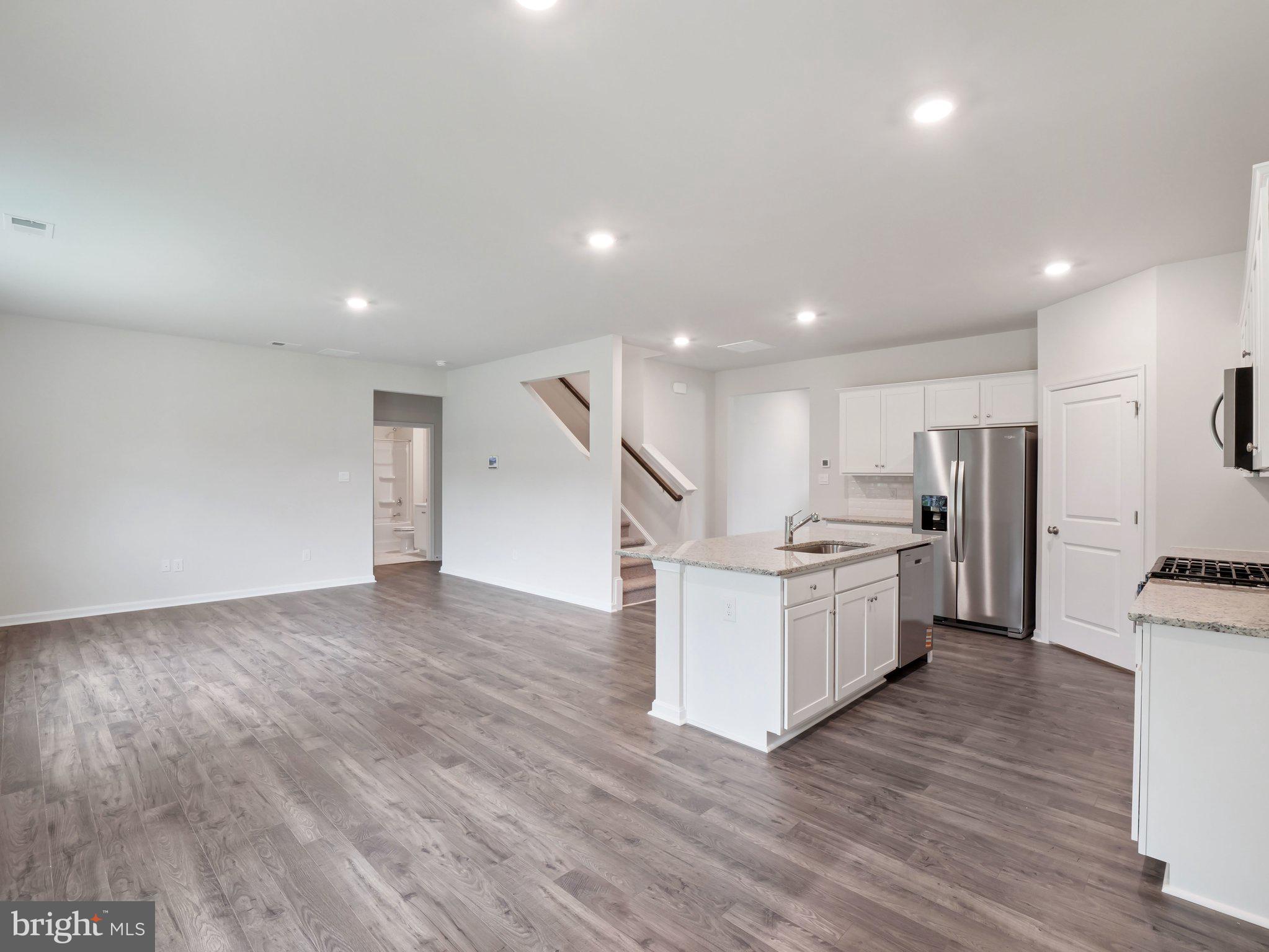 6302 Sterling Way Ruther Glen, VA 22546 - Photo 6 of 31 a kitchen with furniture and a wooden floor