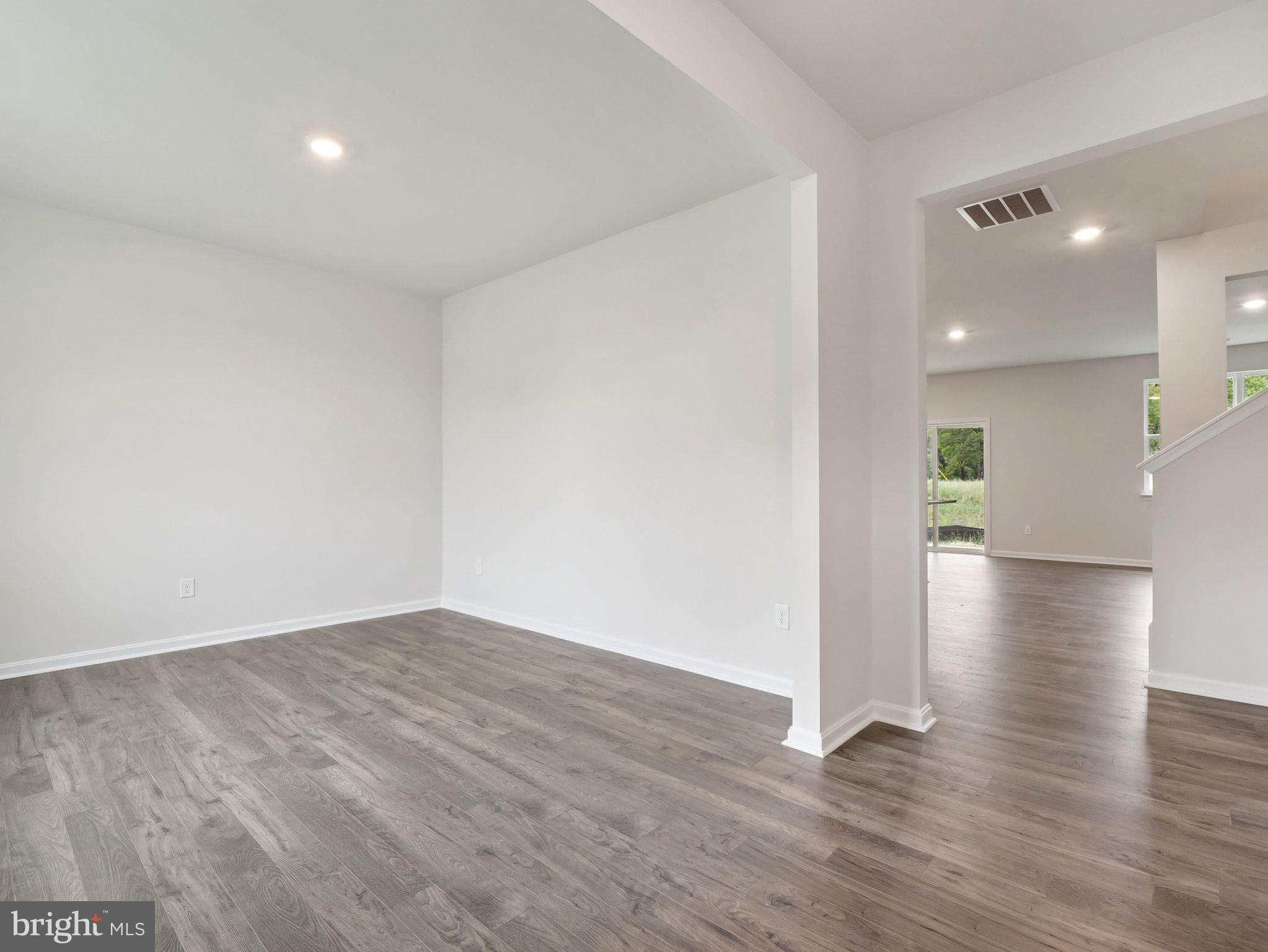 6302 Sterling Way Ruther Glen, VA 22546 - Photo 9 of 31 a view of a hallway with wooden floor