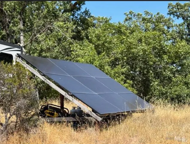a view of a backyard of the house