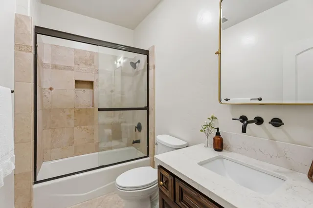 a view of a swimming pool with a patio and a yard