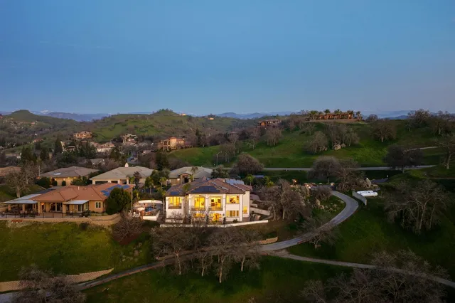 a lobby with furniture and floor to ceiling window