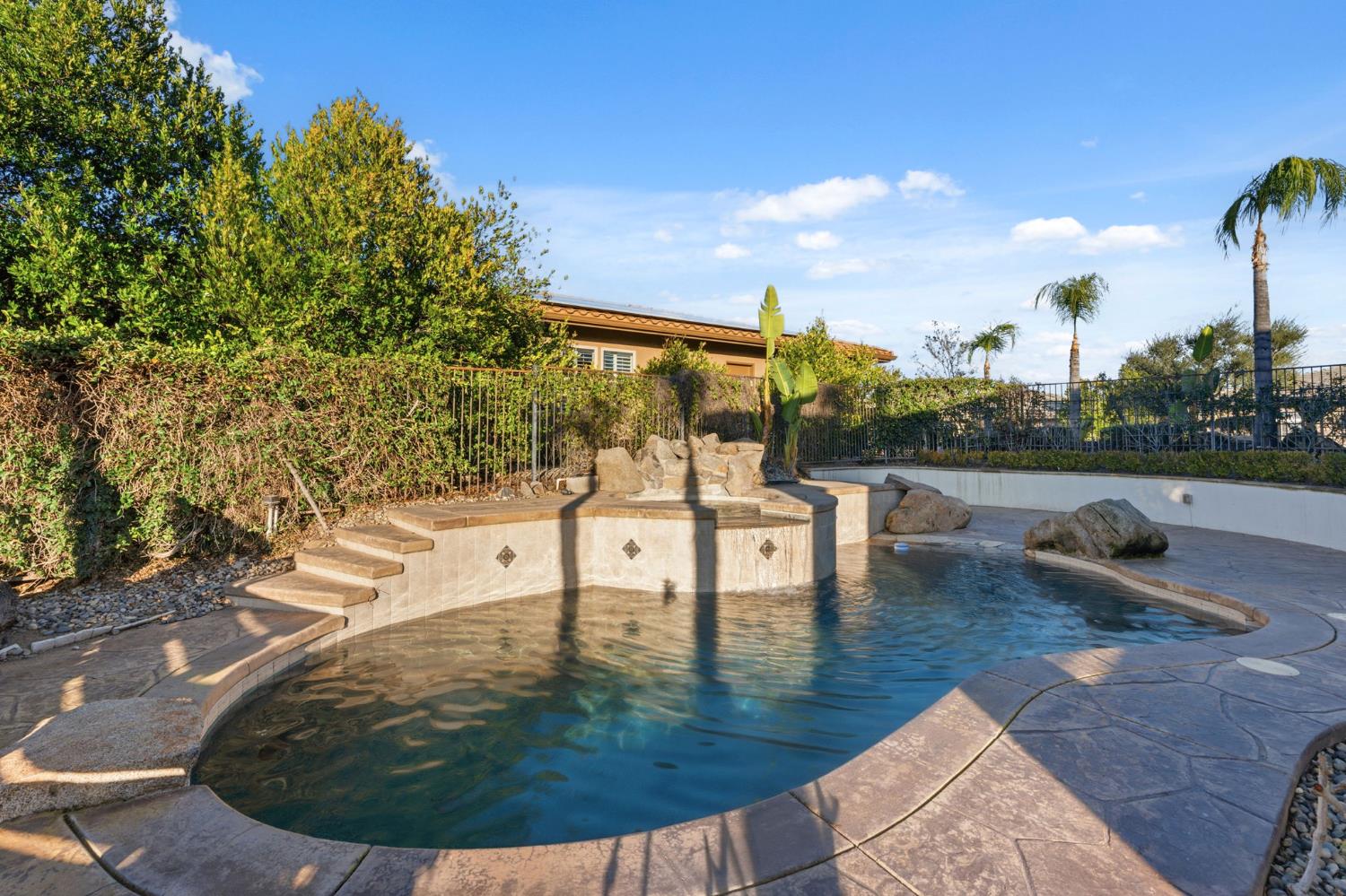 22221 Masters Drive Friant, CA 93626 - Photo 31 of 87 a view of a swimming pool with a patio