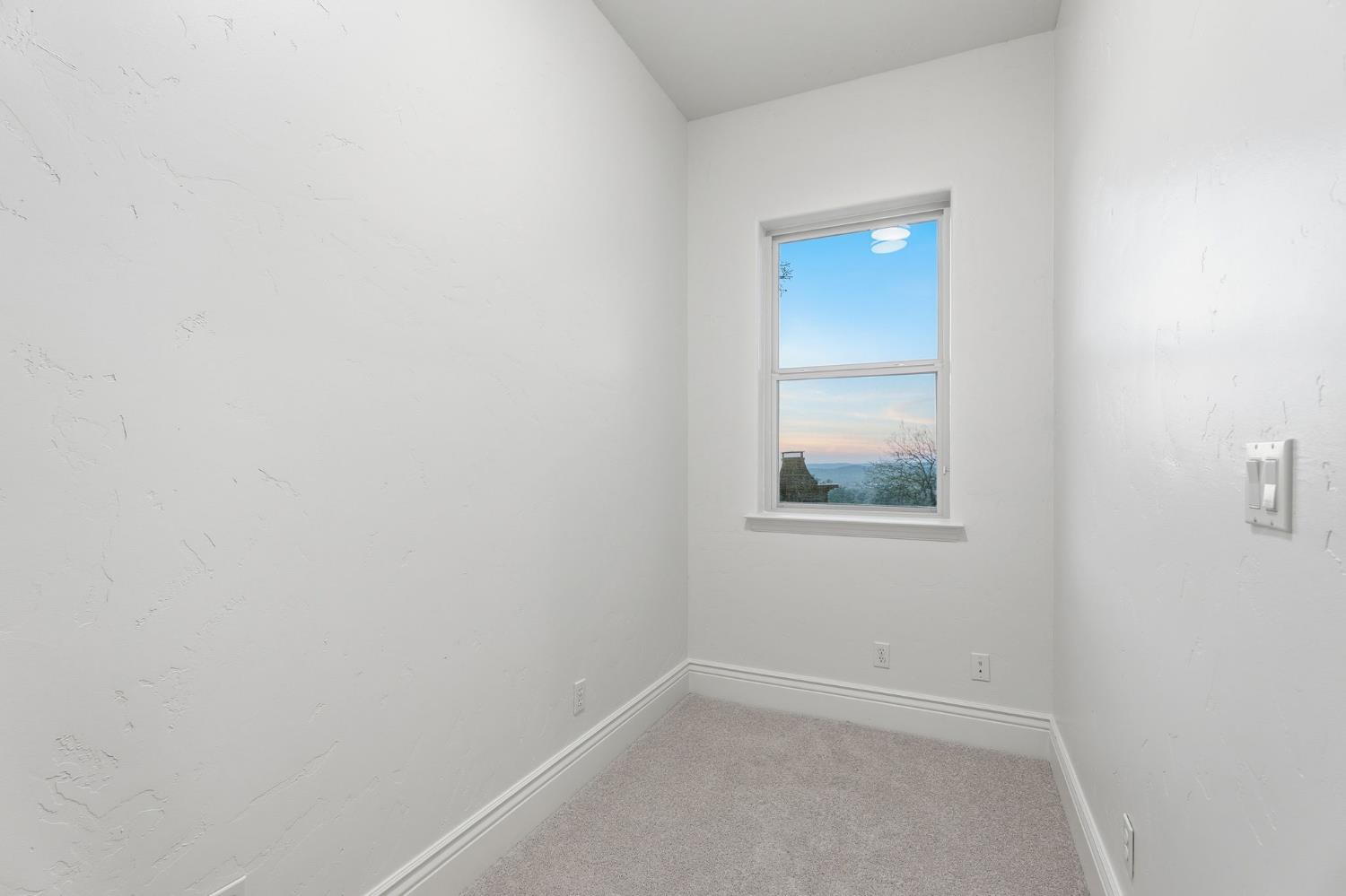 22221 Masters Drive Friant, CA 93626 - Photo 39 of 87 a view of an empty room with closet and window