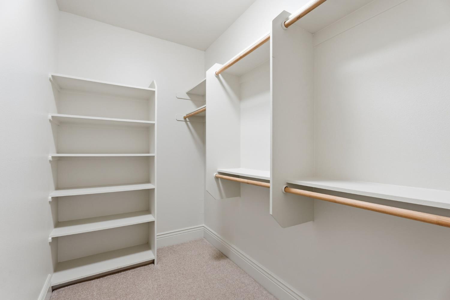 22221 Masters Drive Friant, CA 93626 - Photo 43 of 87 a view of walk in closet with empty racks