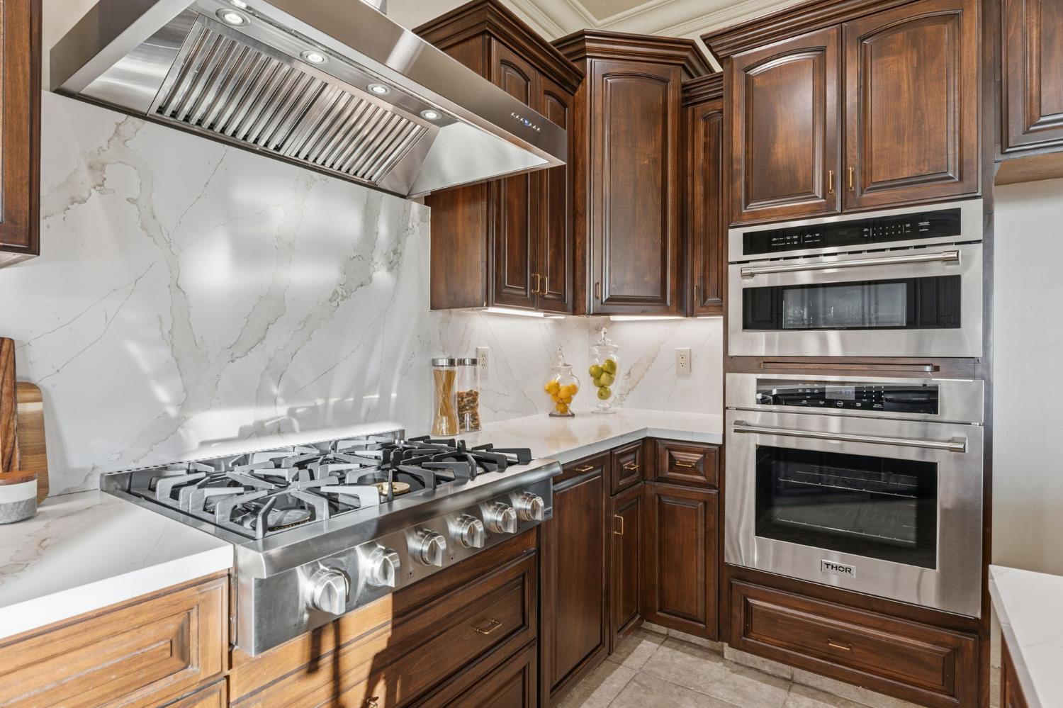 22221 Masters Drive Friant, CA 93626 - Photo 78 of 87 a kitchen with granite countertop a stove and a sink