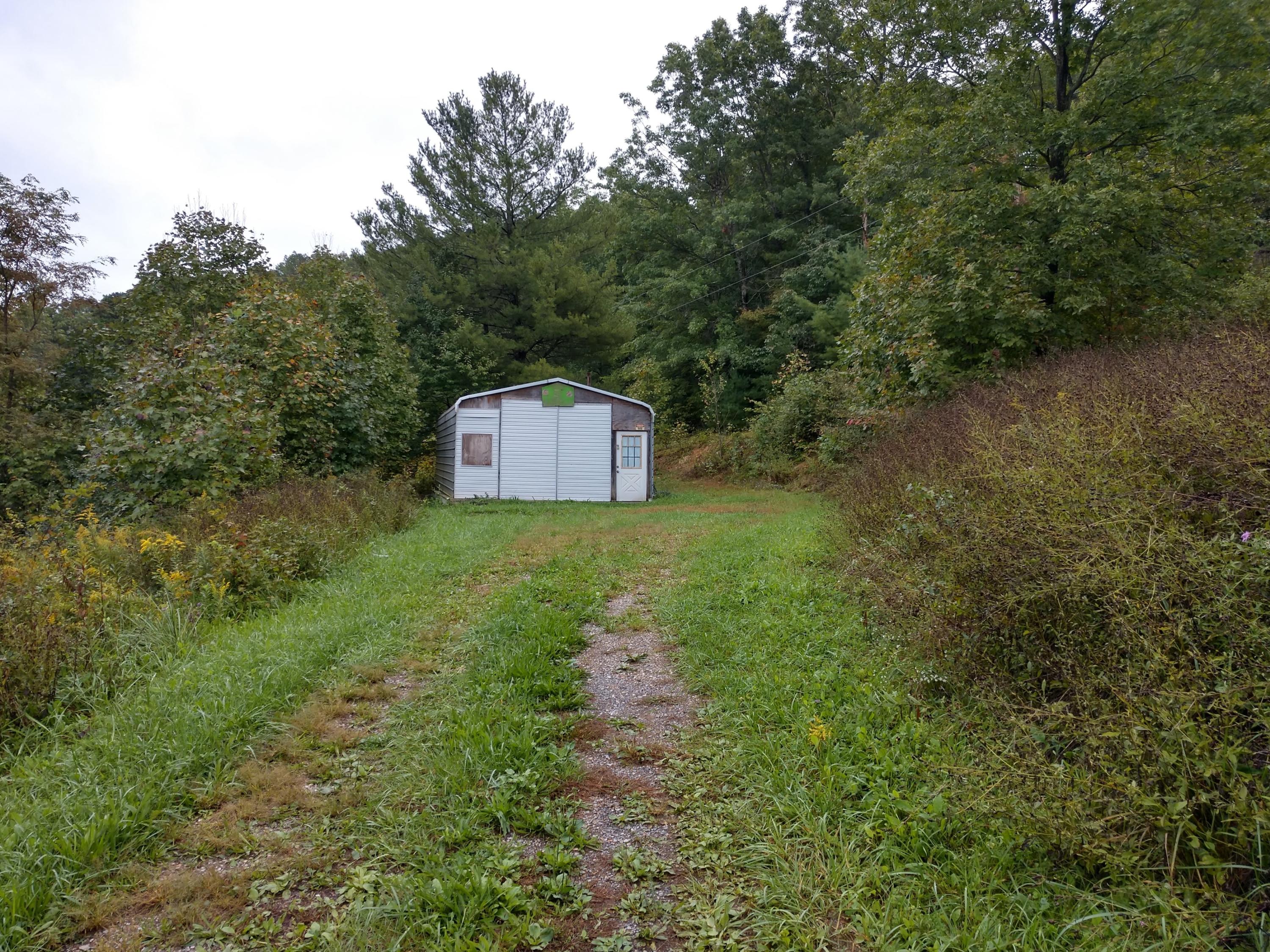 1090 Lexington Lane Riner, VA 24149 - Photo 12 of 12 a view of a big yard with large trees
