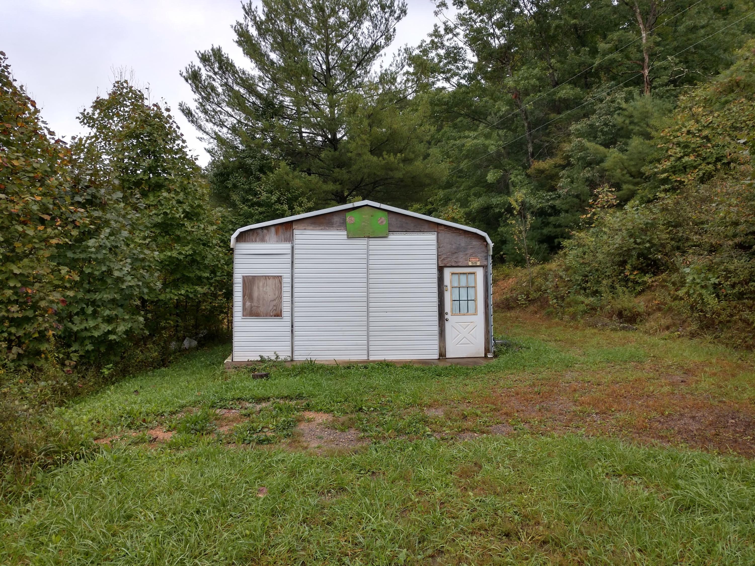 1090 Lexington Lane Riner, VA 24149 - Photo 9 of 12 a backyard of a house with lots of green space