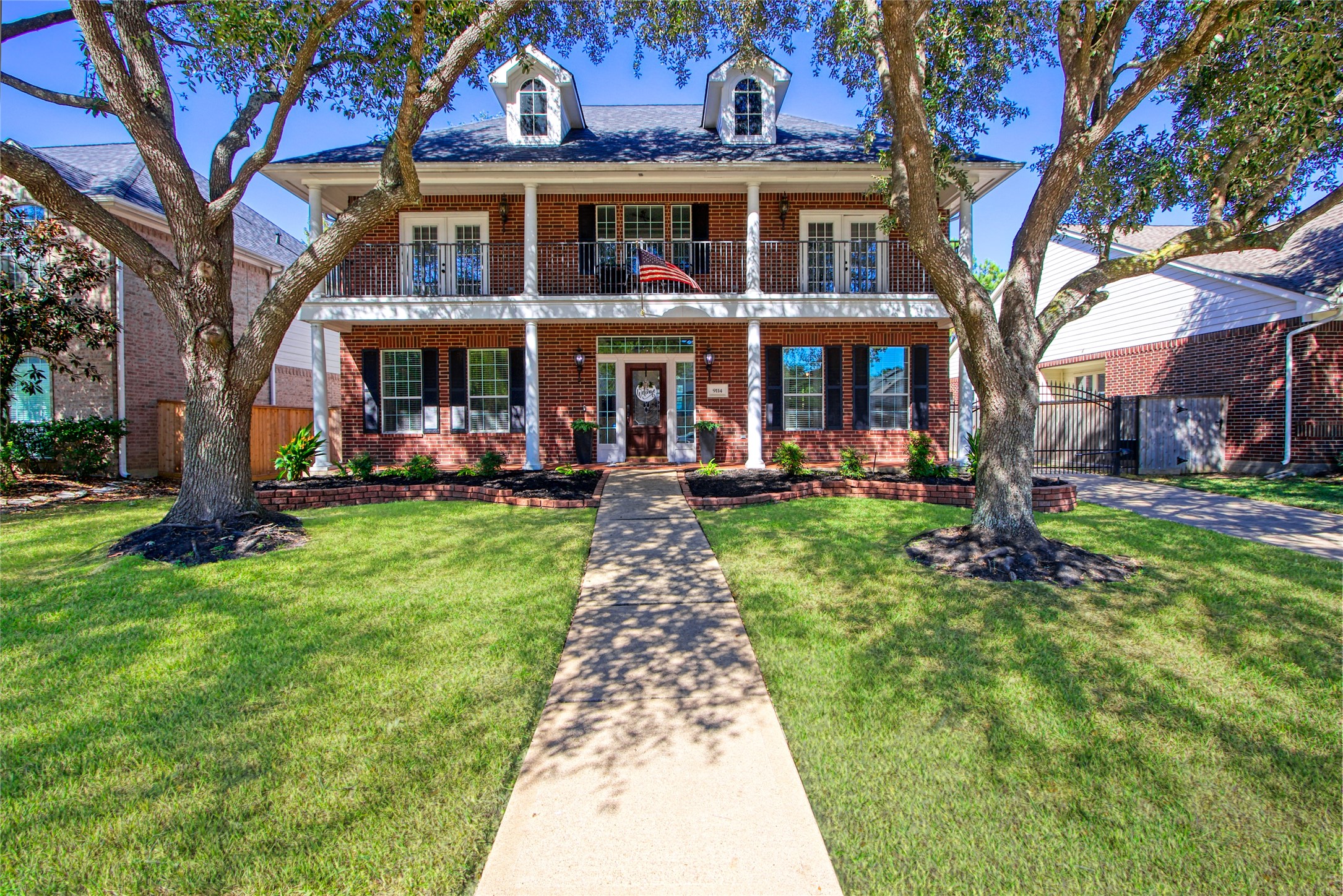 9114 Kirkstone Drive Spring, TX 77379 - Photo 1 of 31 a front view of a building with garden