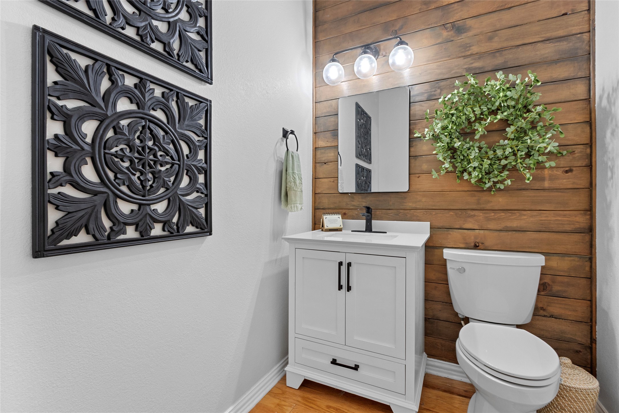 9114 Kirkstone Drive Spring, TX 77379 - Photo 16 of 31 a bathroom with a toilet sink and mirror