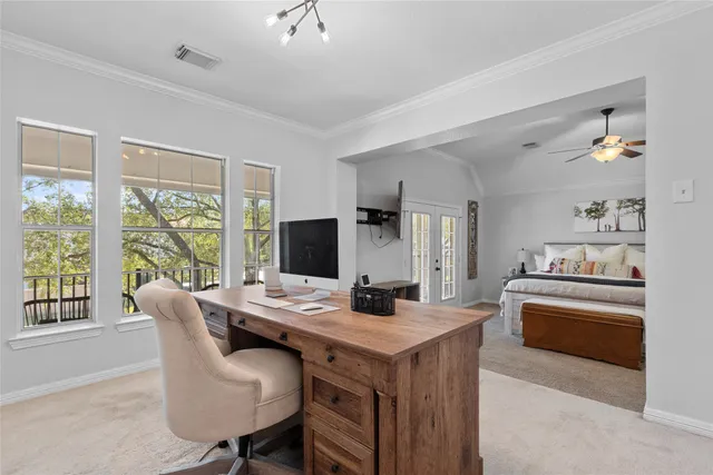 a dining room with furniture and a flat screen tv
