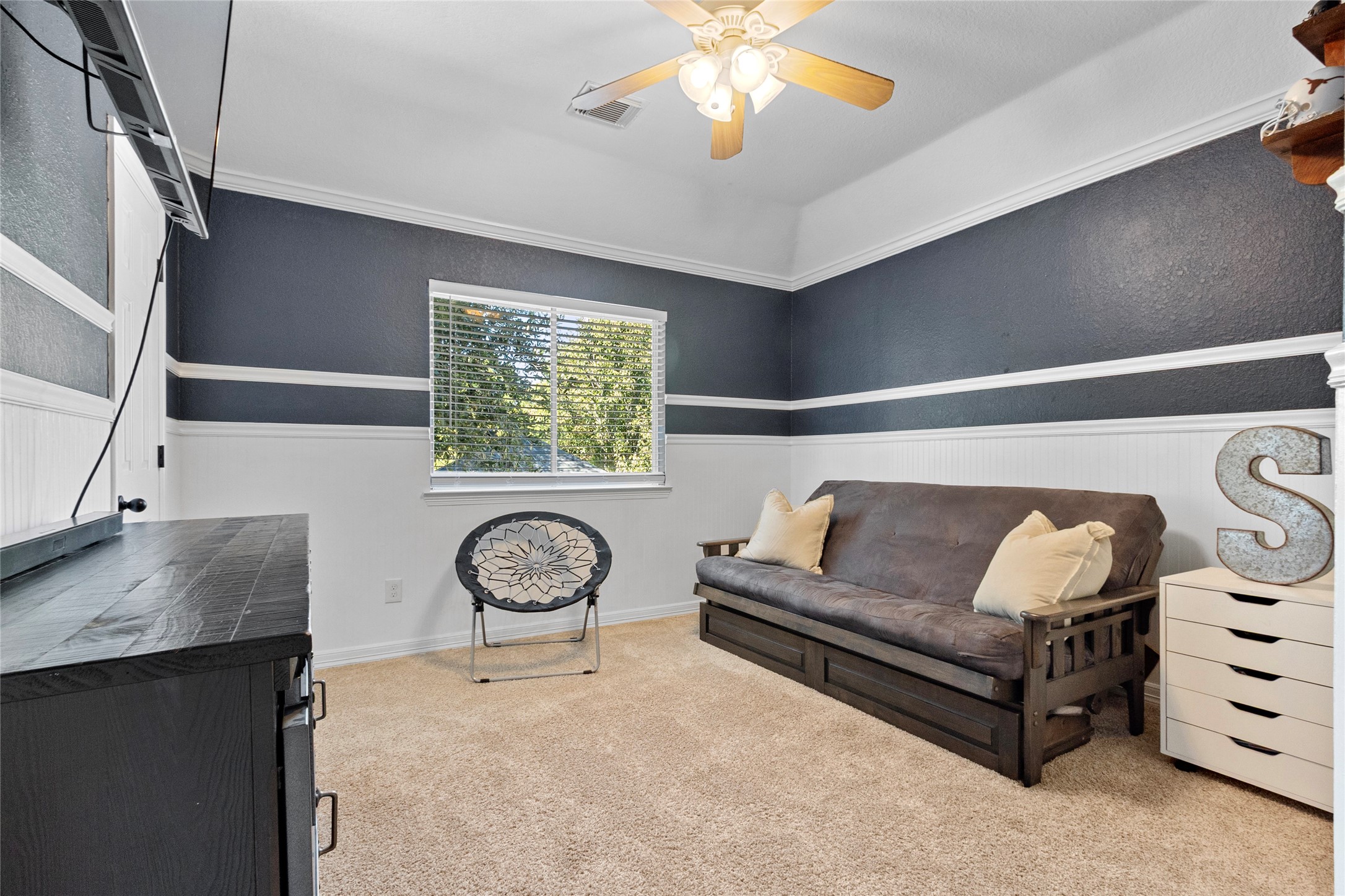 9114 Kirkstone Drive Spring, TX 77379 - Photo 25 of 31 a living room with furniture a chandelier and a window