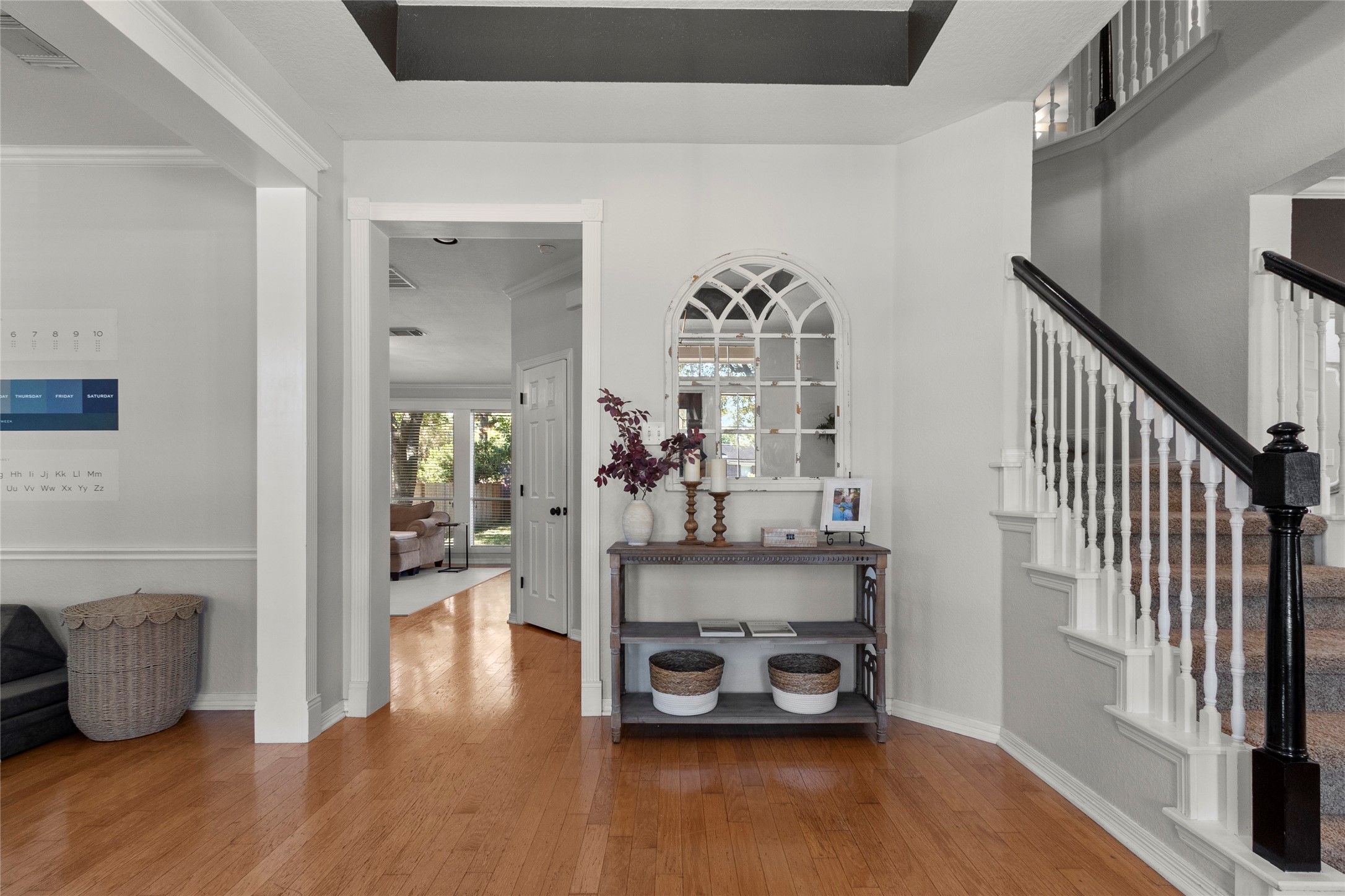 9114 Kirkstone Drive Spring, TX 77379 - Photo 4 of 31 a room with wooden floor and a potted plant
